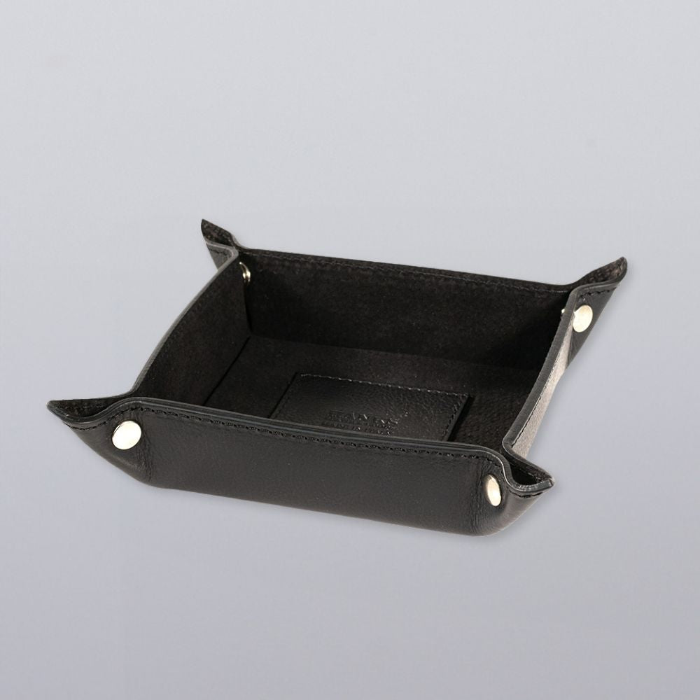 The Hanks Belts Italian Large Valet Tray, crafted from black Italian leather with silver snap buttons, features raised sides and a flat base—perfect for organizing small items. Displayed on a light gray background.