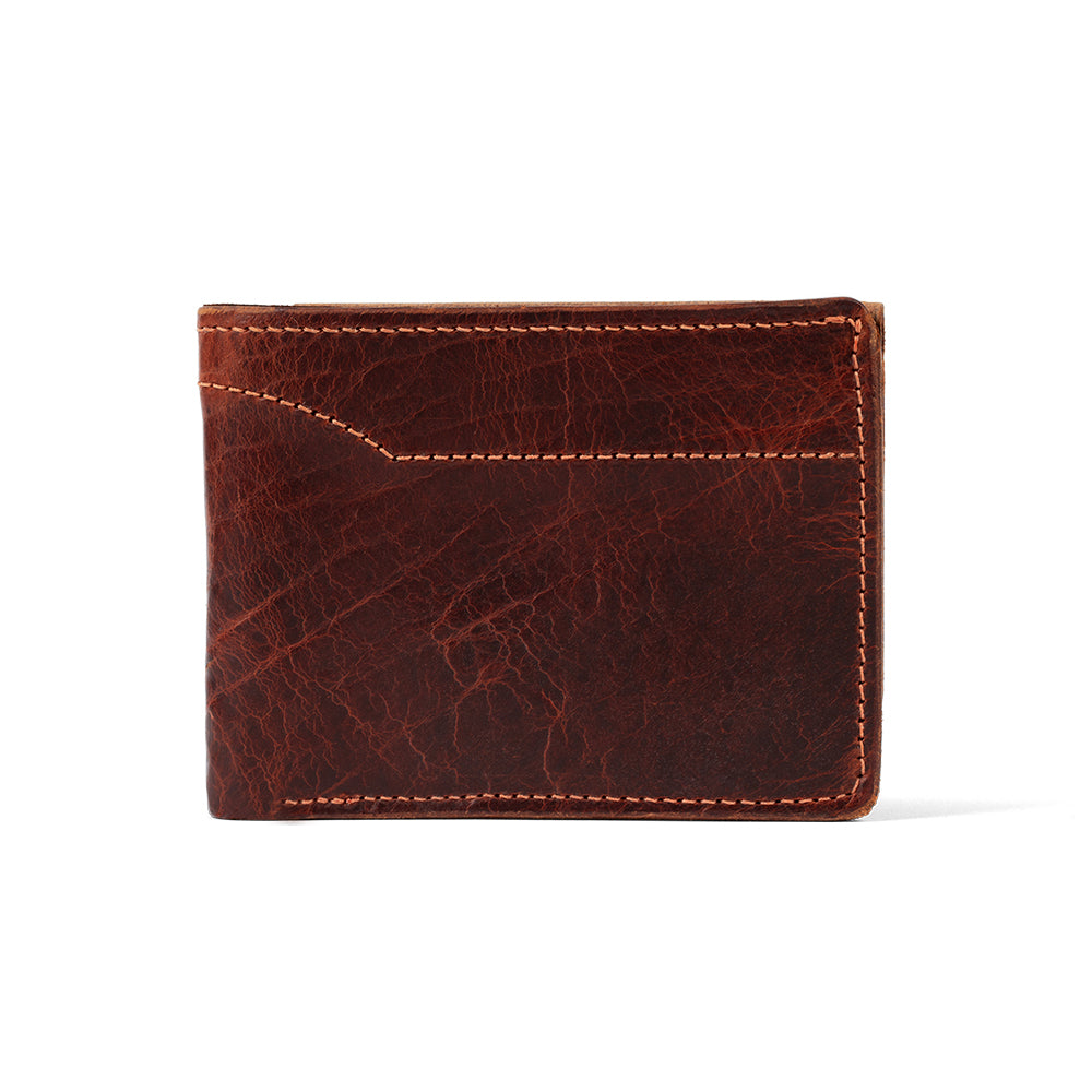 The Powell Bison Bifold with ID Window by Hanks Belts is a stylish brown bison leather wallet with visible stitching and a textured surface, featuring a small front pocket. It appears closed against a plain white background.