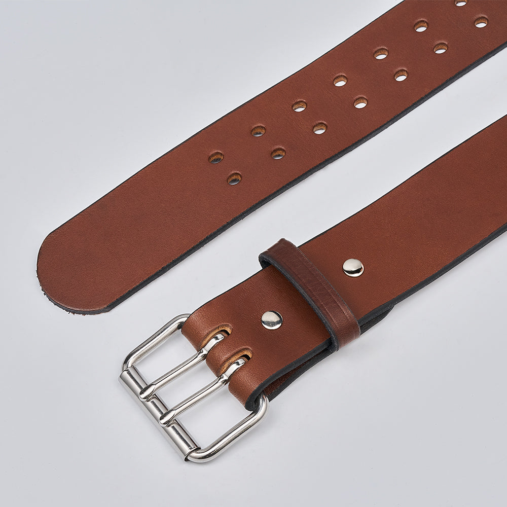 The Marshall by Hanks Belts is a brown leather garrison belt with a silver double-prong buckle and multiple adjustment holes, shown laid flat on a light gray background.