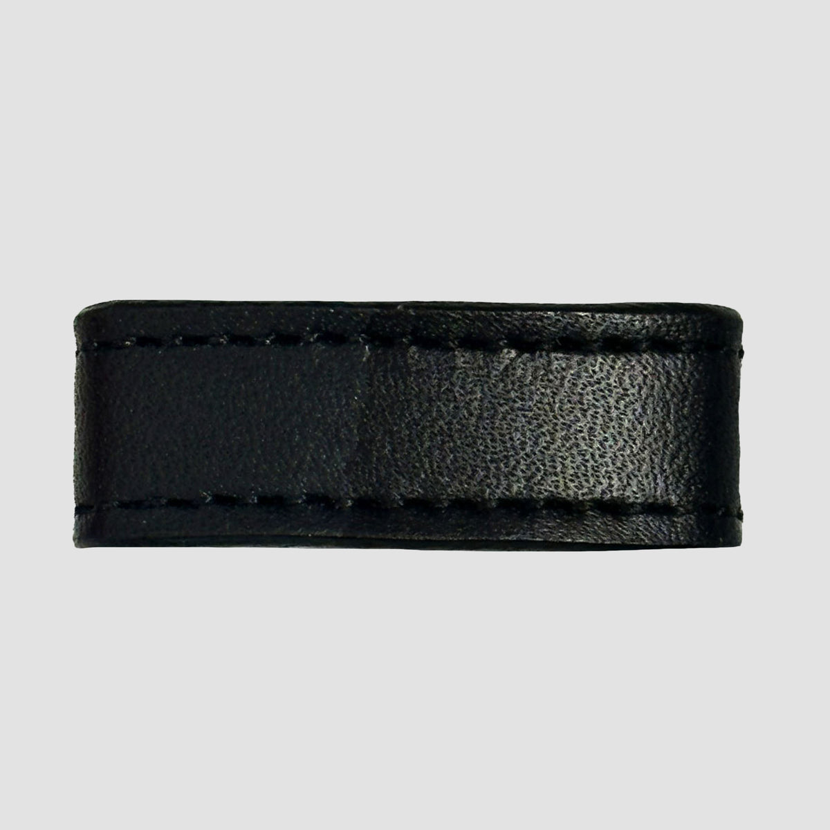 A close-up of the Hanks Belts 1.5" Stitched #10 Keeper, crafted from black vegetable tanned leather with visible edge stitching, displayed against a plain light gray background.