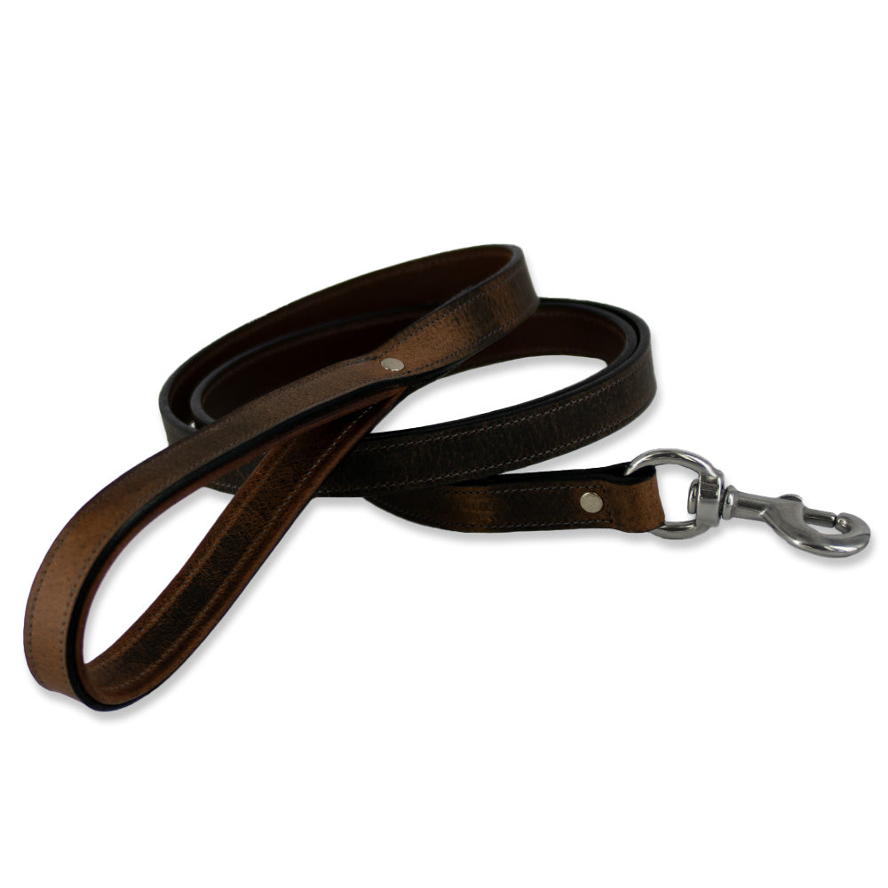 The Kodak Bison Leash by Hanks Belts is a brown dog leash made of premium bison leather with stainless steel hardware, featuring a looped handle and silver clasp, shown coiled on a white background.