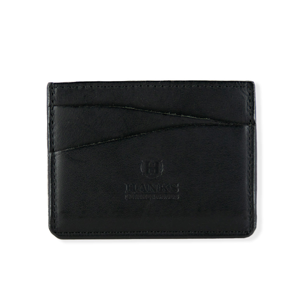 A black leather Cumberland Bison Card Holder from Hanks Belts, featuring the logo and text "Hanks Leather Goods" embossed in the center. Made from durable bison leather, it has two slanted card slots on the front with visible stitching along the edges.