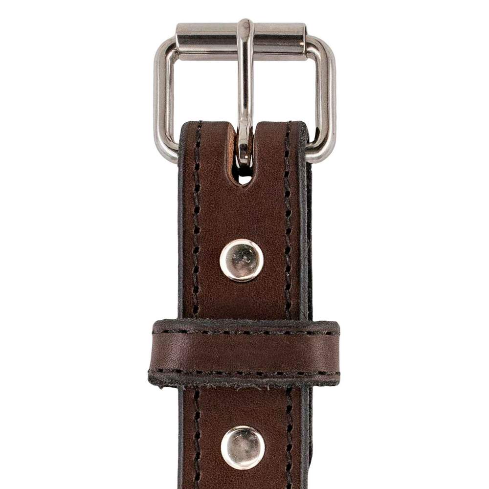 Close-up of The Xtreme Belt - 1.25" by Hanks Belts, featuring durable leather, black stitching, a silver heavy-duty roller buckle, two silver rivets, and visible belt loop and tip.