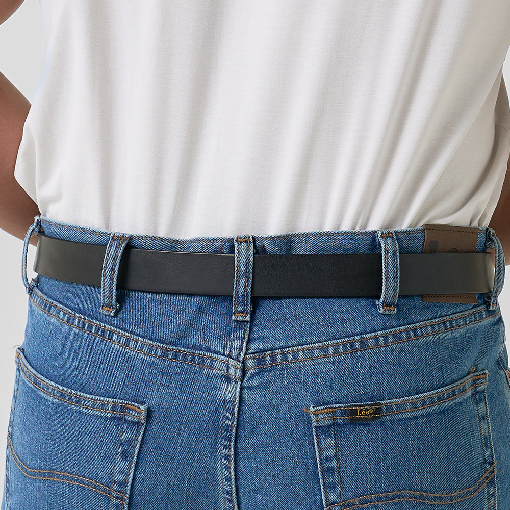 A person wearing blue jeans with visible stitching and a leather brand patch, plus Hanks Belts' "The Deputy" black concealed carry belt and a white tucked-in shirt, seen from the back.