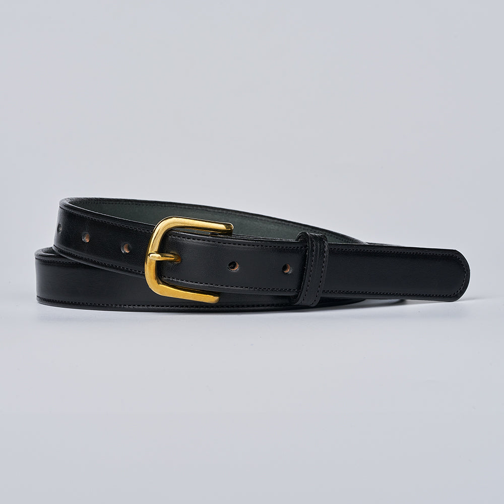 The Addyson - 1" by Hanks Belts is a classic belt crafted from English Bridle Full-Grain Leather, featuring a shiny gold brass buckle and displayed coiled against a simple light gray background.