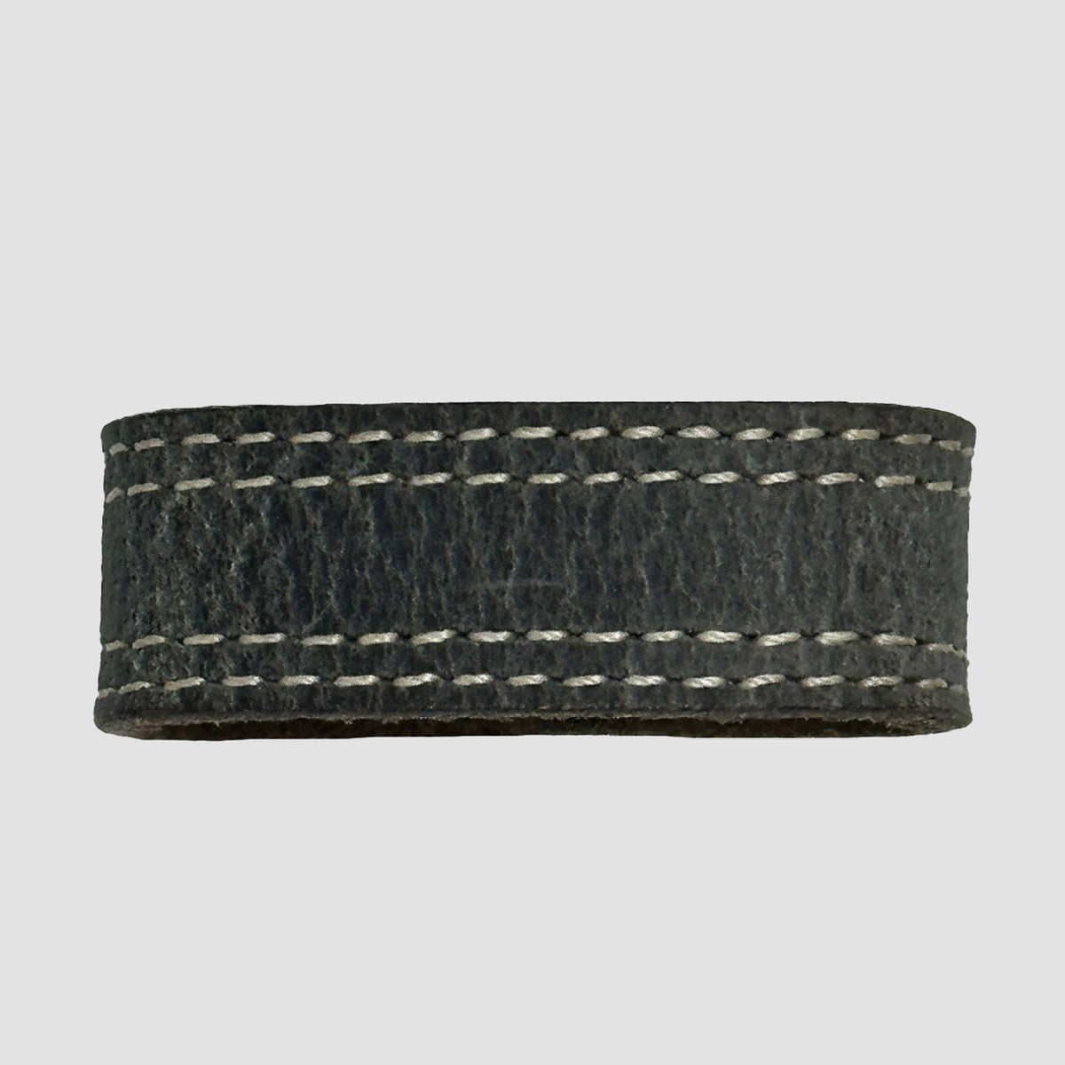 A close-up of the Hanks Belts 1.5" Double Stitched #6 Keeper, a black leather accessory with white edge stitching, shown on a plain light gray background.