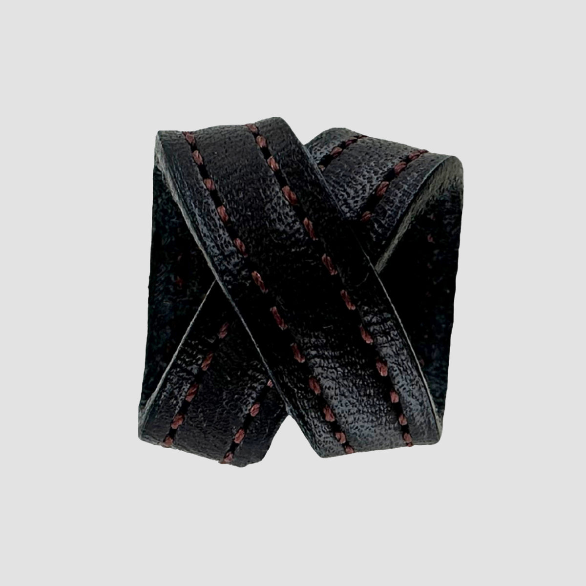 The Hanks Belts .75" Crossover #8 Keeper is a black English bridle leather ring with two overlapping bands and dark red stitching, designed as a .75" wide belt keeper, shown on a plain light gray background.