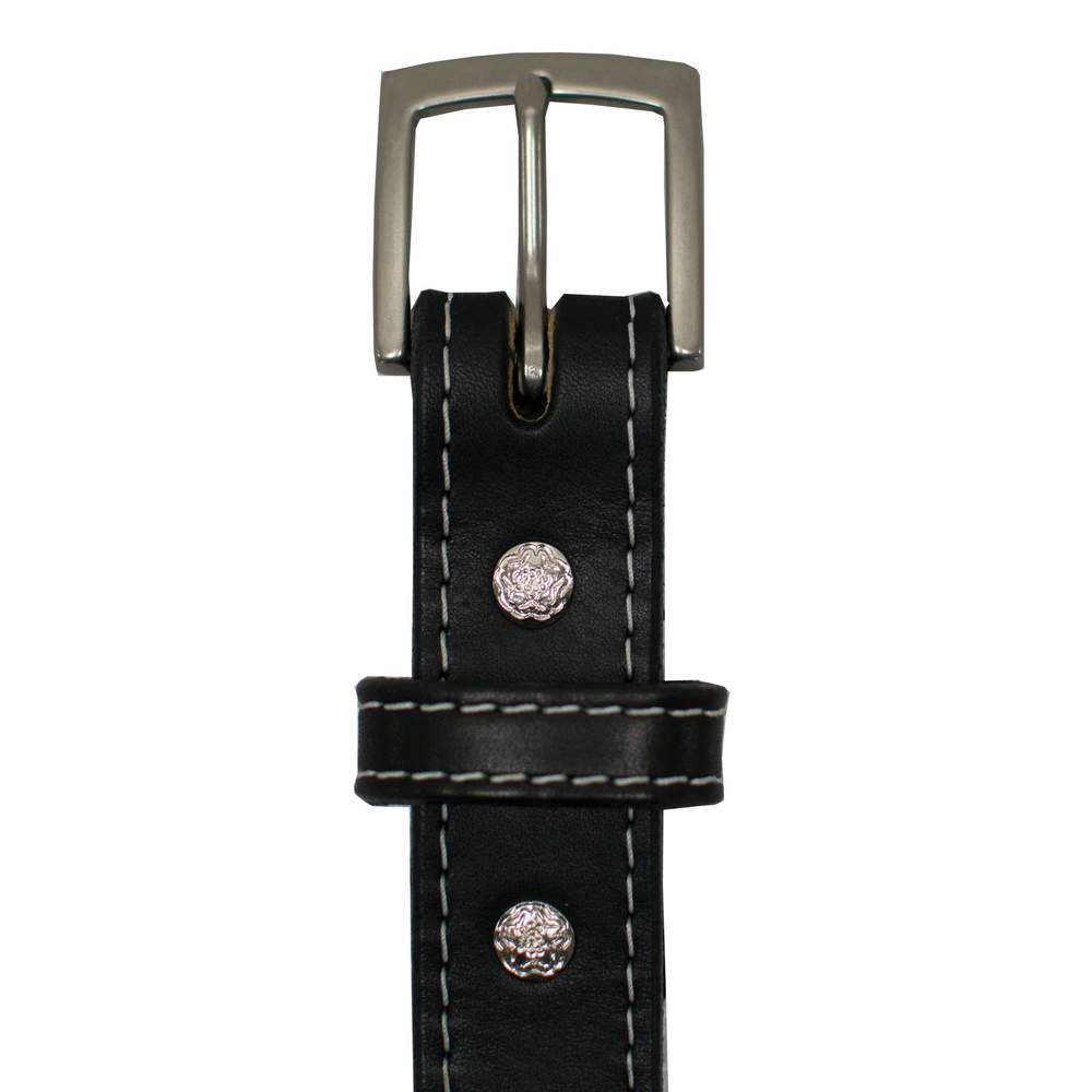 Close-up of The Bonnie by Hanks Belts, crafted from full-grain vegetable tanned leather with white stitching, a silver buckle, and two textured metal studs.